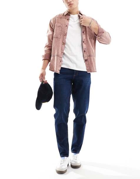 ASOS DESIGN tapered fit stretch jeans in dark wash blue - view 1