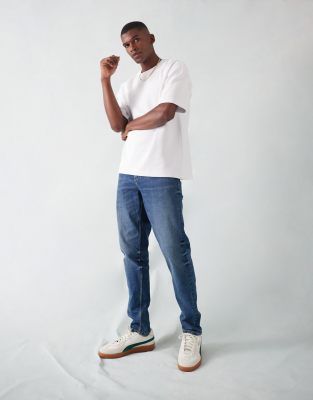 ASOS DESIGN ASOS DESIGN tapered fit stretch jeans in dark wash-Blue