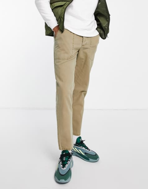 ASOS DESIGN tapered fit trousers in herringbone texture in light khaki - view 1