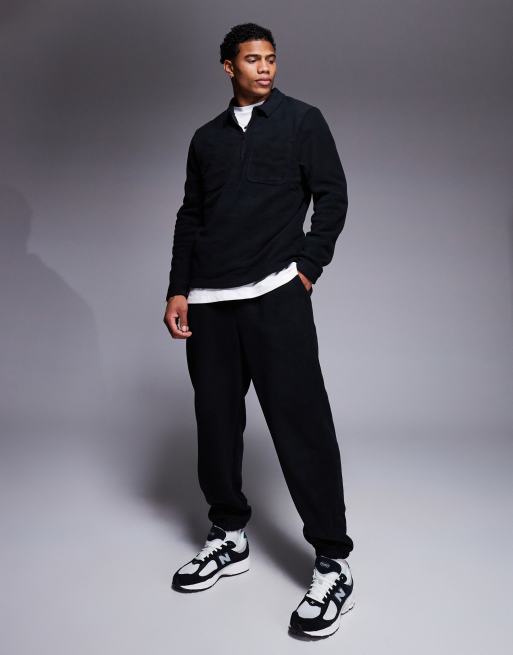 ASOS DESIGN tapered fleece joggers in black