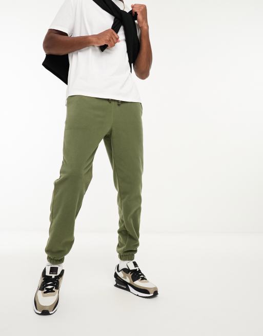 ASOS DESIGN tapered fleece joggers in green | ASOS