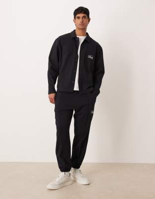 Asos Design Tapered Jacquard Sweatpants With Embroidery In Black
