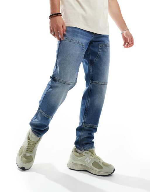 ASOS DESIGN - Tapered jeans i mellemblå vask med tømrerdetaljer