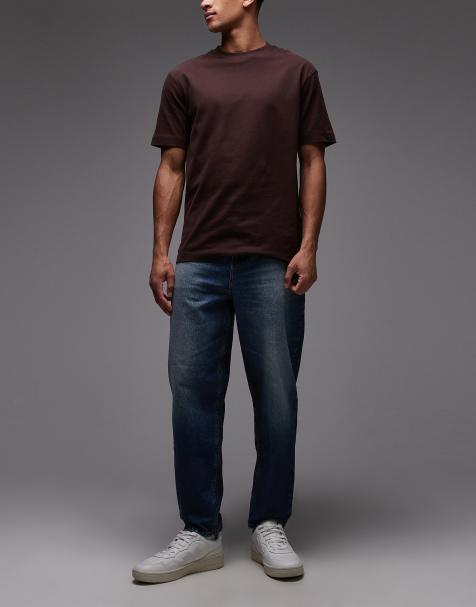 ASOS DESIGN - Tapered jeans i mørkeblå vask og relaxed fit - view 1