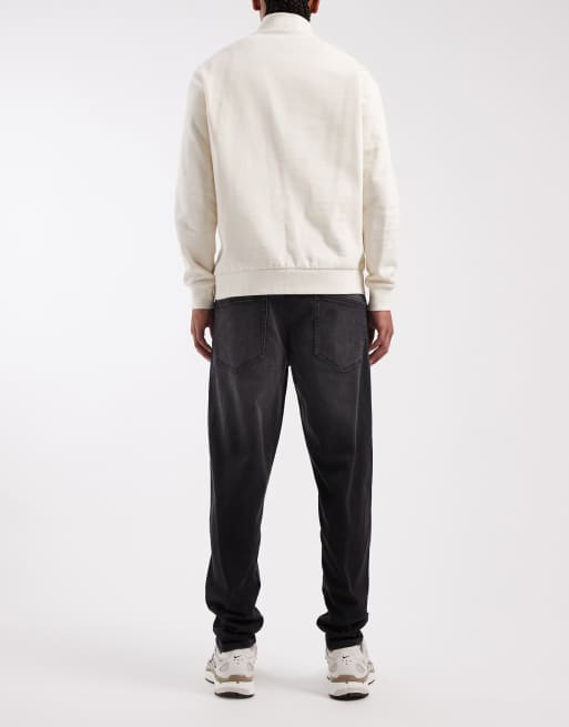 ASOS DESIGN tapered jeans in black wash with stretch