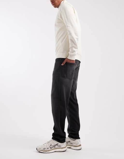 ASOS DESIGN tapered jeans in black wash with stretch