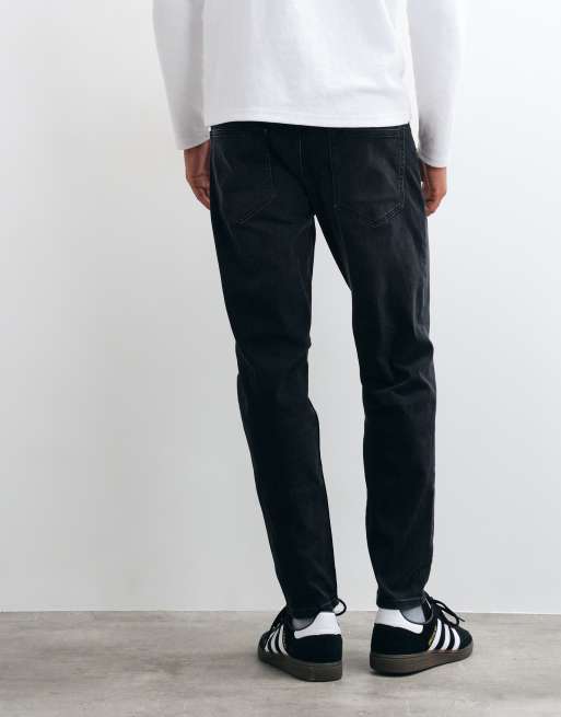 ASOS DESIGN tapered jeans in black wash with stretch, 5 of 5