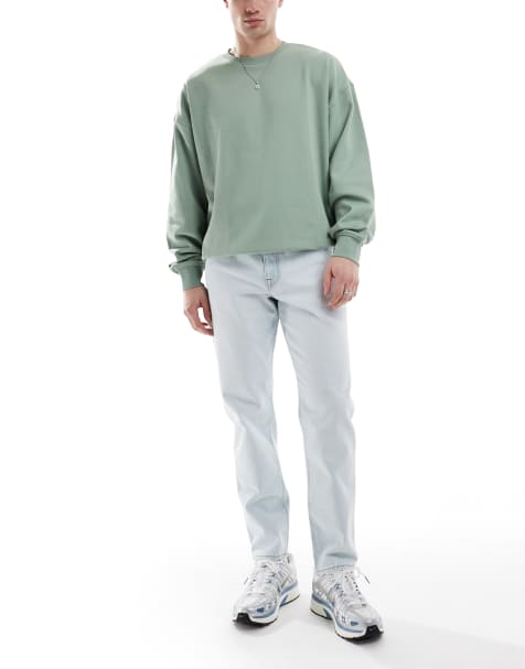 ASOS DESIGN tapered jeans in bleach wash blue - view 1