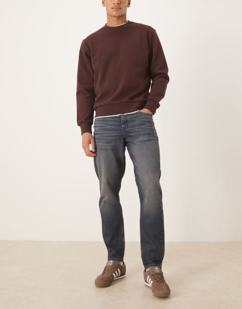 ASOS DESIGN tapered jeans in dark wash blue with tint