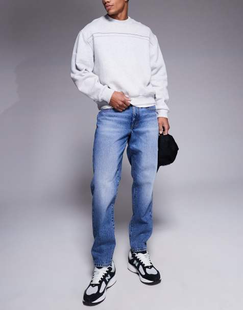ASOS DESIGN tapered jeans in dark wash blue - view 1
