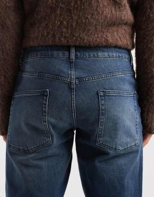 ASOS DESIGN tapered jeans in dark wash blue, 5 of 5