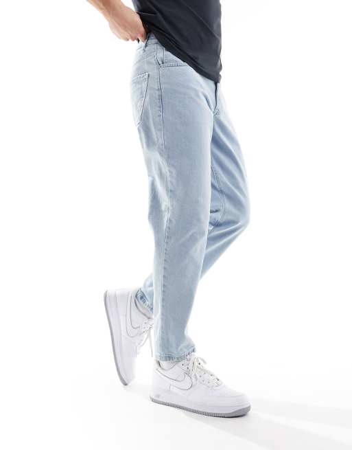 ASOS DESIGN tapered jeans in light stone wash blue