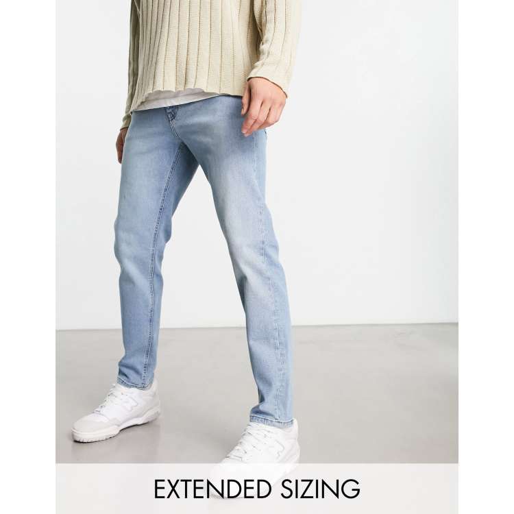 ASOS DESIGN tapered jeans in light wash blue