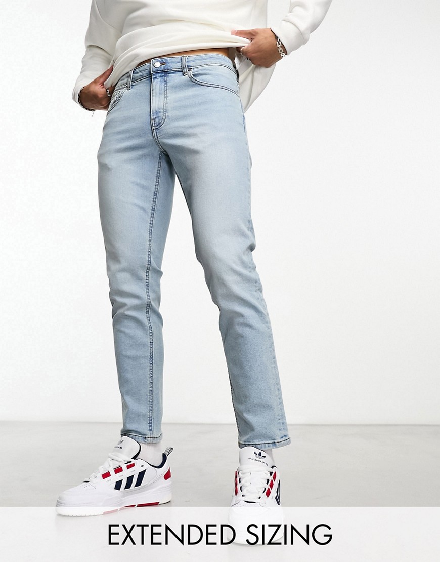 ASOS DESIGN tapered jeans in light wash blue