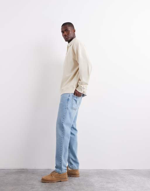 ASOS DESIGN tapered jeans in light wash blue