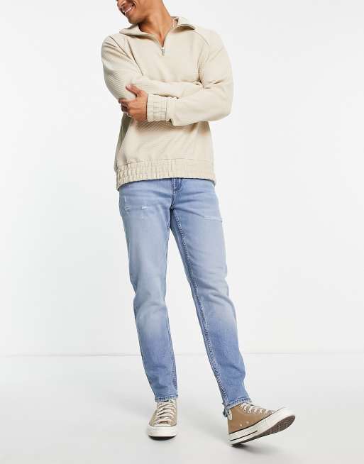 ASOS DESIGN tapered jeans in light wash blue