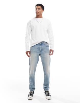 Asos Design Tapered Jeans In Mid Wash Blue Tint