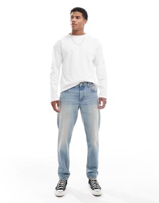 ASOS DESIGN tapered jeans in mid wash blue tint