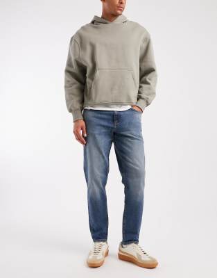 Asos Design Tapered Jeans In Blue