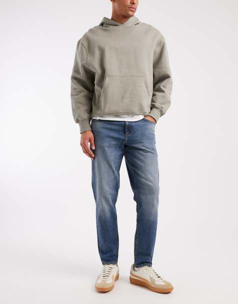 ASOS DESIGN tapered jeans in mid wash blue with tint - view 1