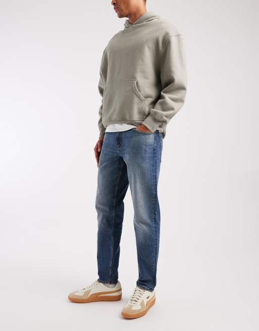 ASOS DESIGN tapered jeans in mid wash blue with tint, 2 of 5