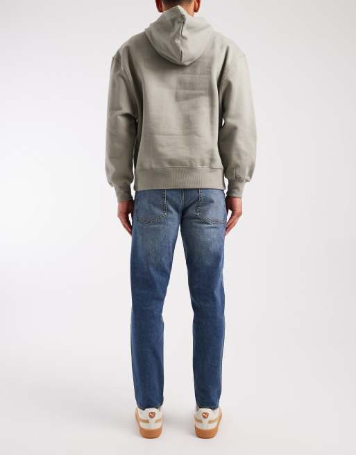 ASOS DESIGN tapered jeans in mid wash blue with tint, 3 of 5
