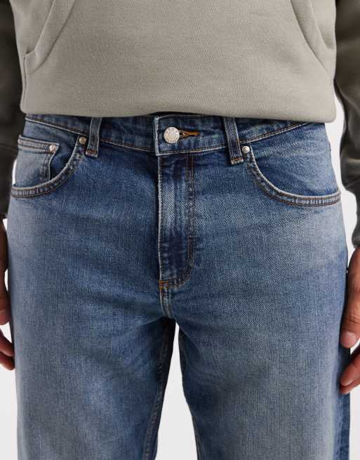 ASOS DESIGN tapered jeans in mid wash blue with tint, 4 of 5