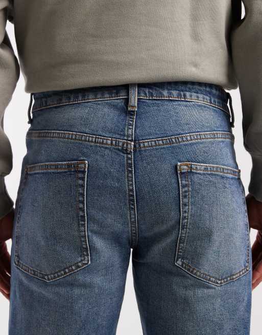 ASOS DESIGN tapered jeans in mid wash blue with tint, 5 of 5