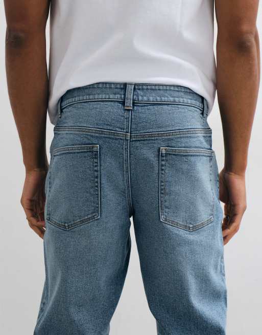 ASOS DESIGN tapered jeans in mid wash blue with tint, 5 of 5