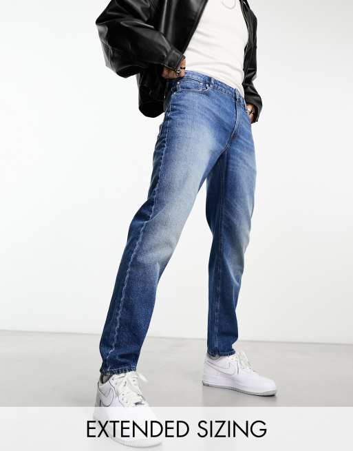 ASOS DESIGN stretch tapered jeans in 90s mid wash