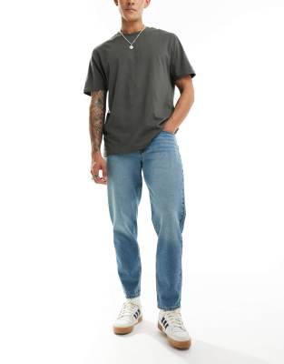 ASOS DESIGN ASOS DESIGN tapered jeans in mid wash blue
