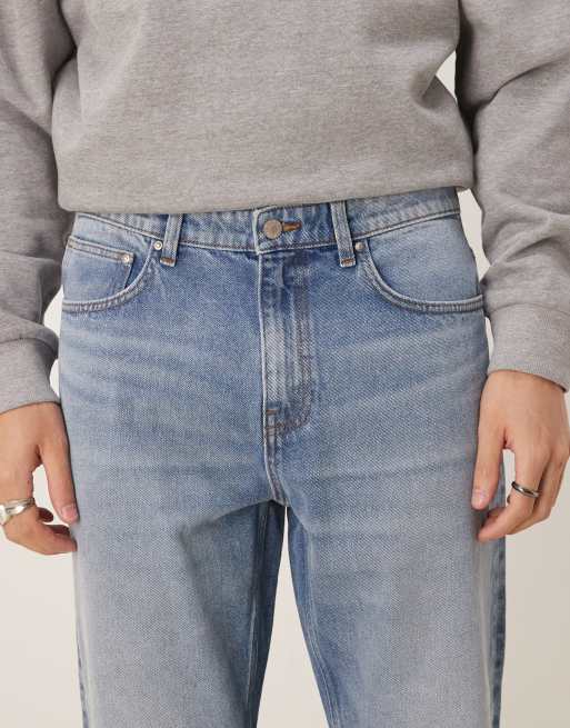 ASOS DESIGN tapered jeans in mid wash blue, 4 of 5