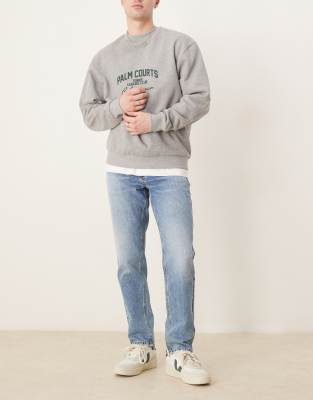 ASOS DESIGN tapered jeans in mid wash blue