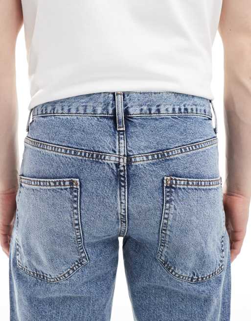 ASOS DESIGN tapered jeans in mid wash blue, 4 of 5