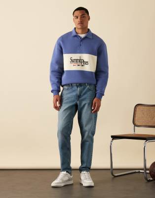 ASOS DESIGN tapered jeans in mid wash blue