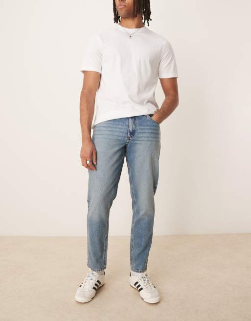 ASOS DESIGN tapered jeans in mid wash blue