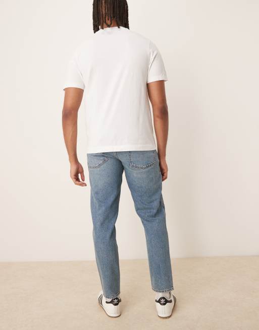 ASOS DESIGN tapered jeans in mid wash blue