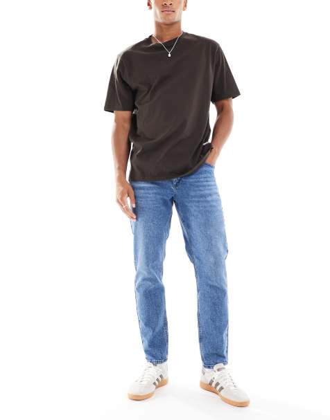 ASOS DESIGN tapered jeans in mid wash blue - view 1