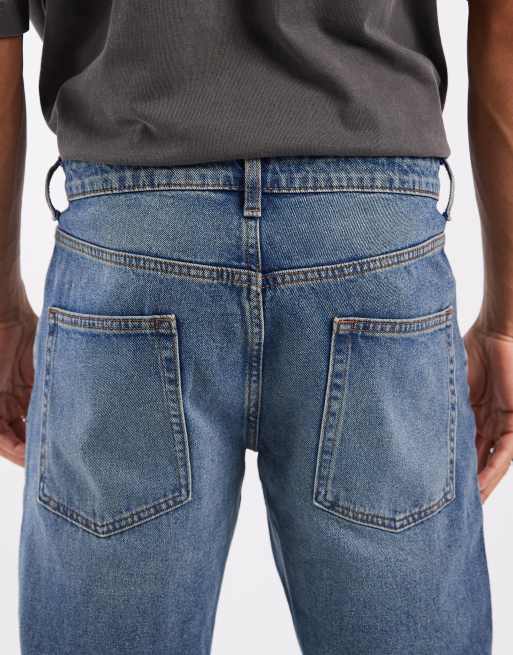 ASOS DESIGN tapered jeans in mid wash blue, 5 of 5