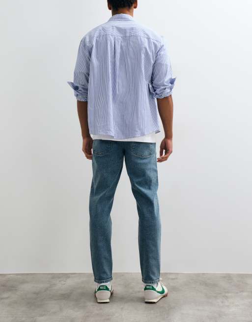 ASOS DESIGN tapered jeans in mid wash blue, 3 of 5