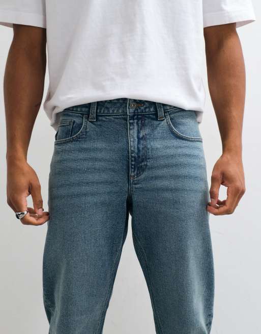 ASOS DESIGN tapered jeans in mid wash blue, 4 of 5