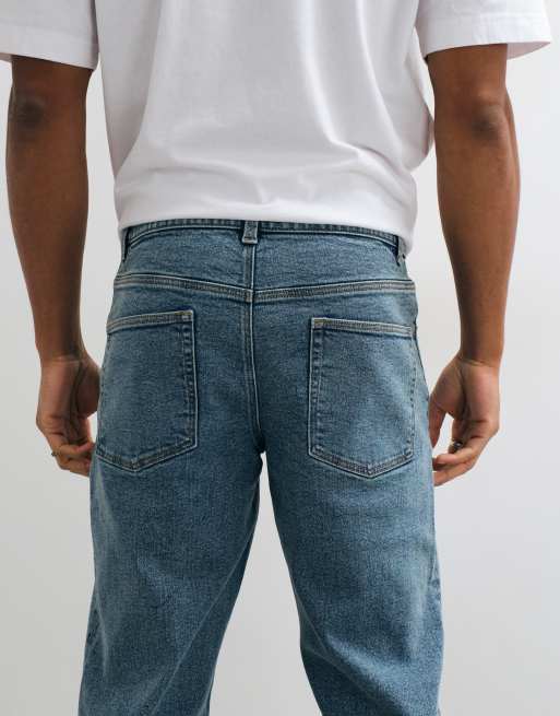 ASOS DESIGN tapered jeans in mid wash blue, 5 of 5