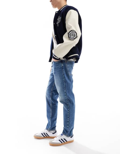 ASOS DESIGN tapered jeans in tinted dark wash blue , 2 of 5