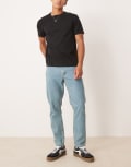 [ASOS DESIGN] ASOS DESIGN tapered jeans in tinted light wash blue W28 L30 Light wash blue