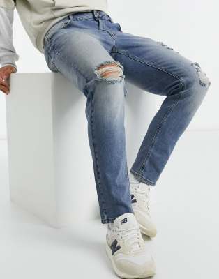 mid wash tapered jeans