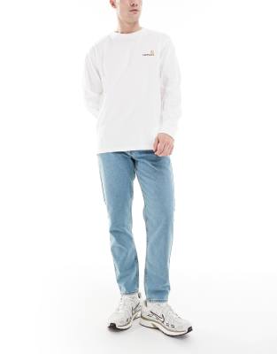 ASOS DESIGN tapered jeans in tinted mid wash blue