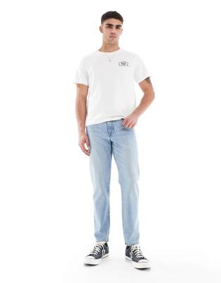 ASOS DESIGN tapered jeans in vintage light blue wash