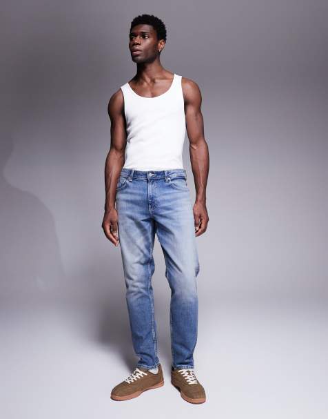 ASOS DESIGN tapered jeans in vintage light wash blue - view 1