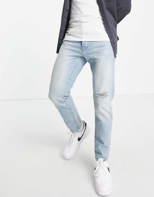 ASOS DESIGN tapered jeans in vintage light wash with rip | ASOS