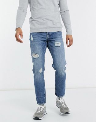ASOS DESIGN tapered jeans in vintage mid wash blue with heavy rips - ASOS Price Checker